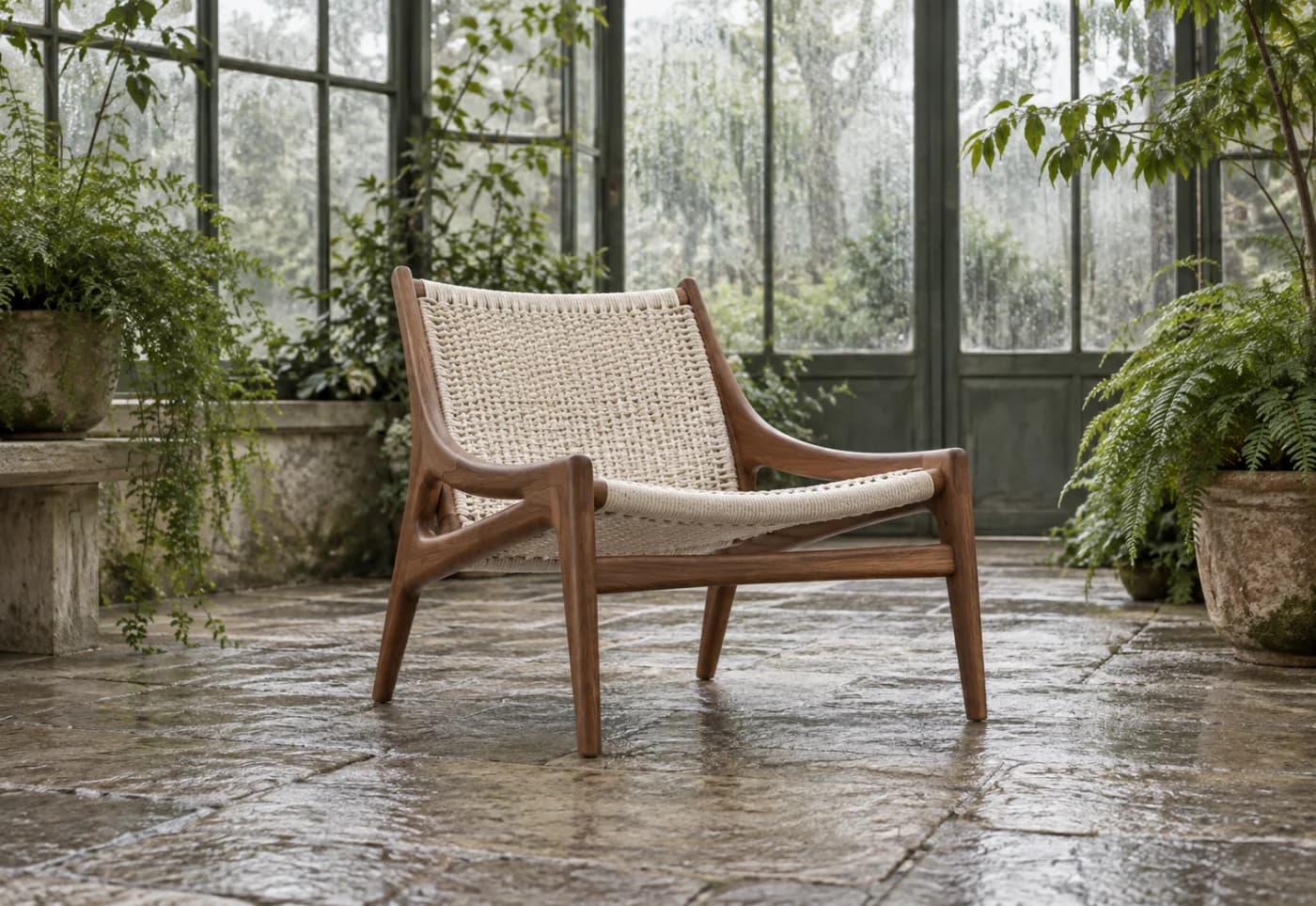 Walnut lounge chair inside a fogged glass conservatory
