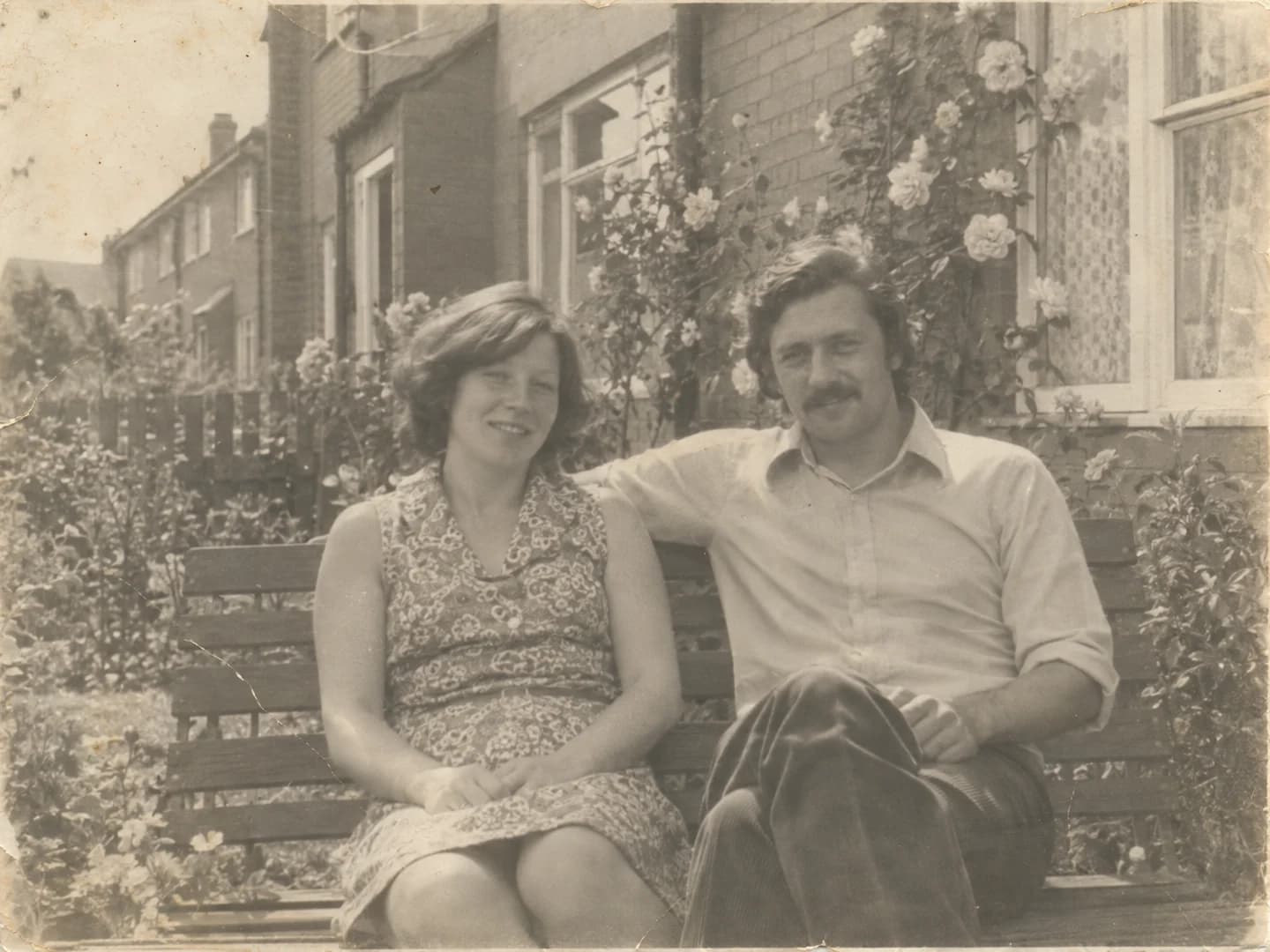 Faded black-and-white family snapshot with light paper scratches