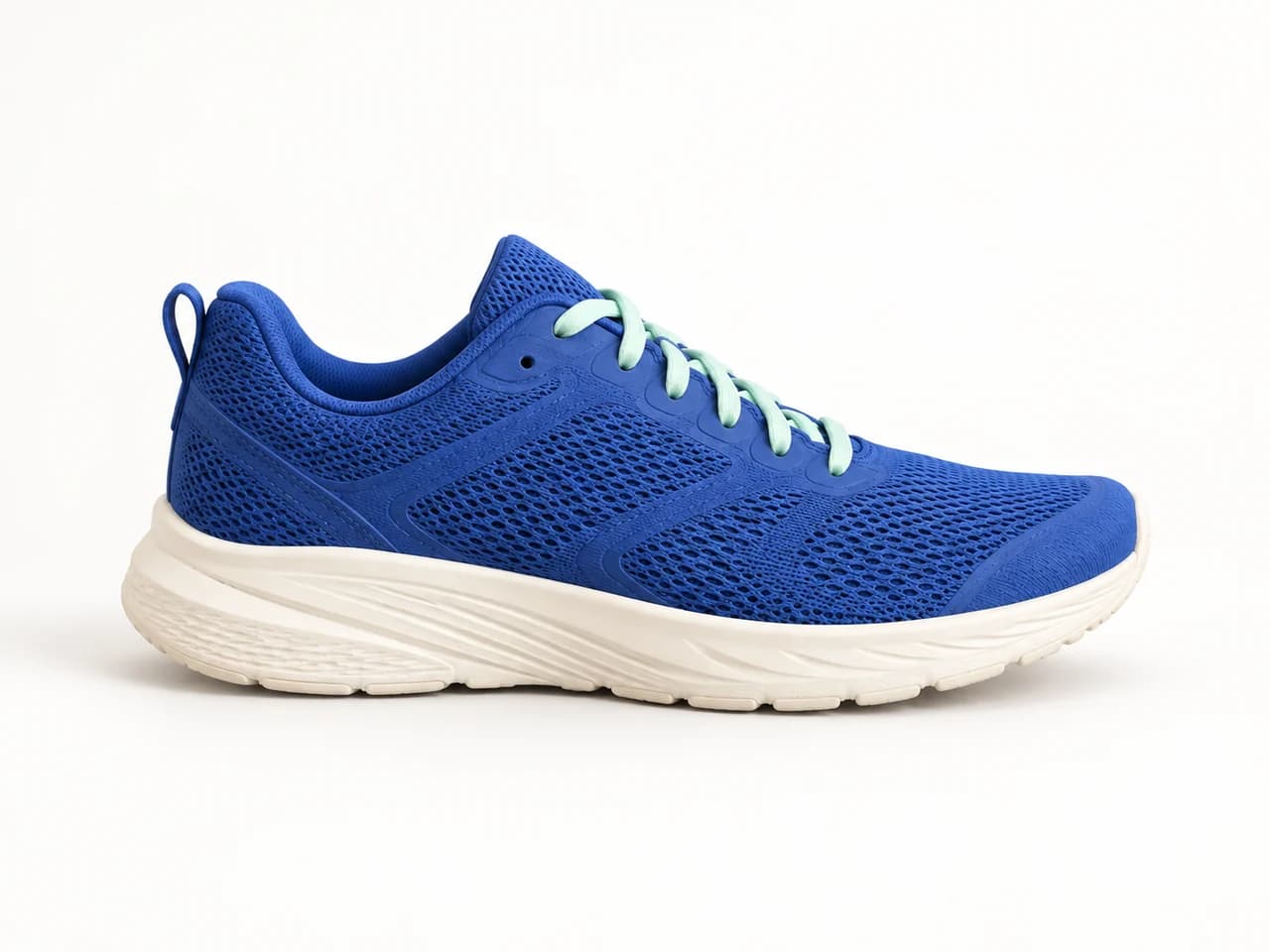 The same blue sneaker on an off-white studio background