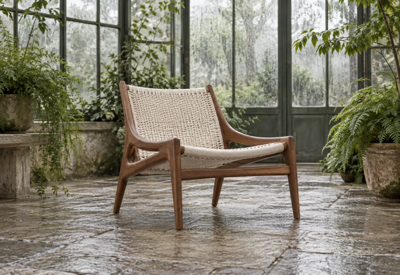 Walnut lounge chair inside a fogged glass conservatory