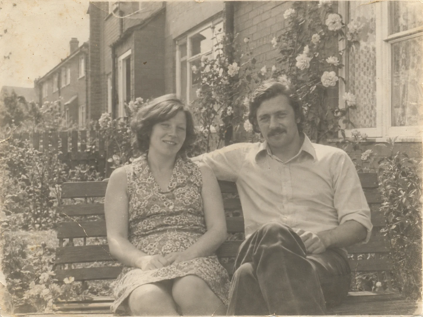 Faded black-and-white family snapshot with light paper scratches