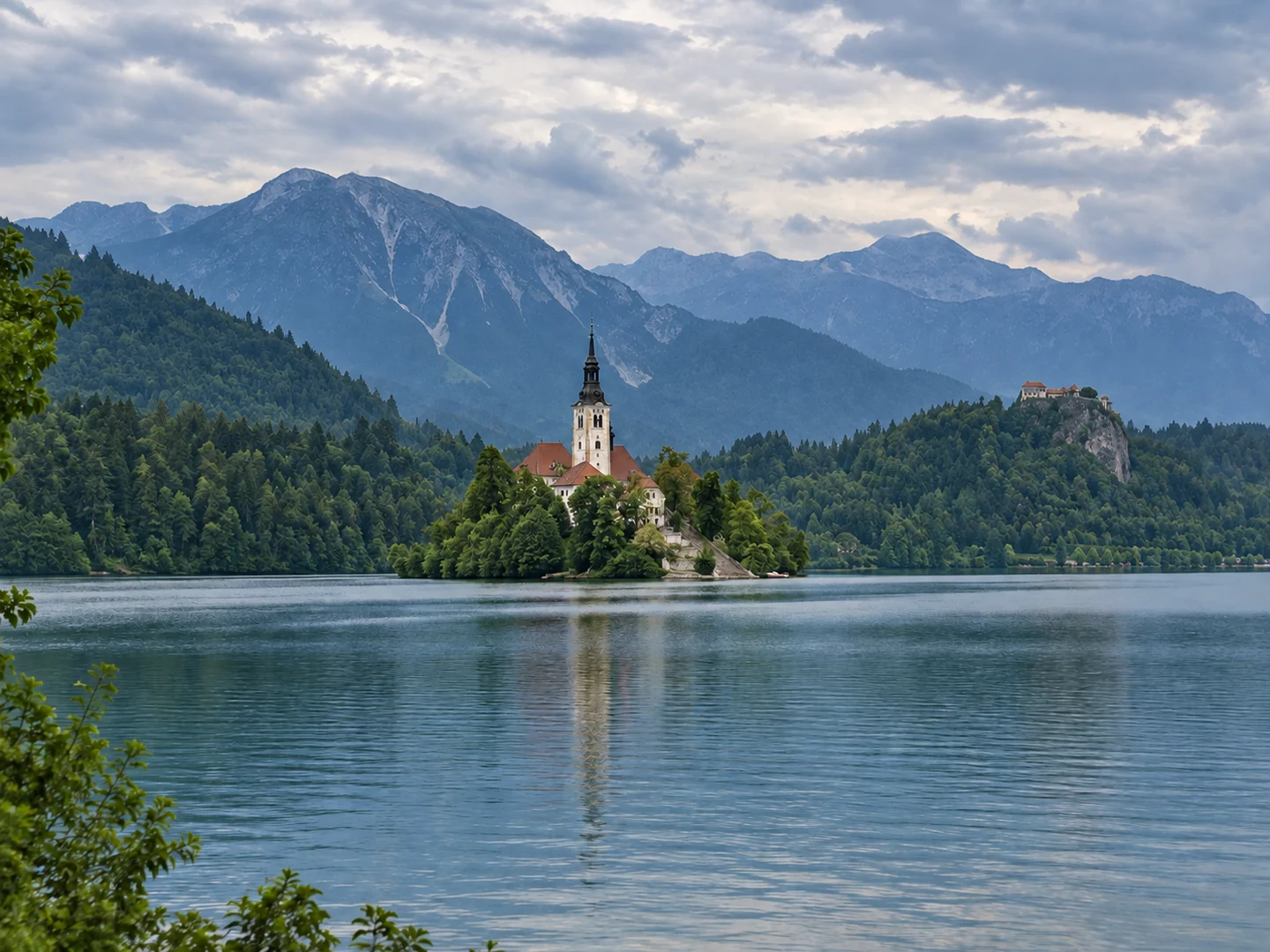 The same alpine lake with clearer mountain layers and balanced natural colors